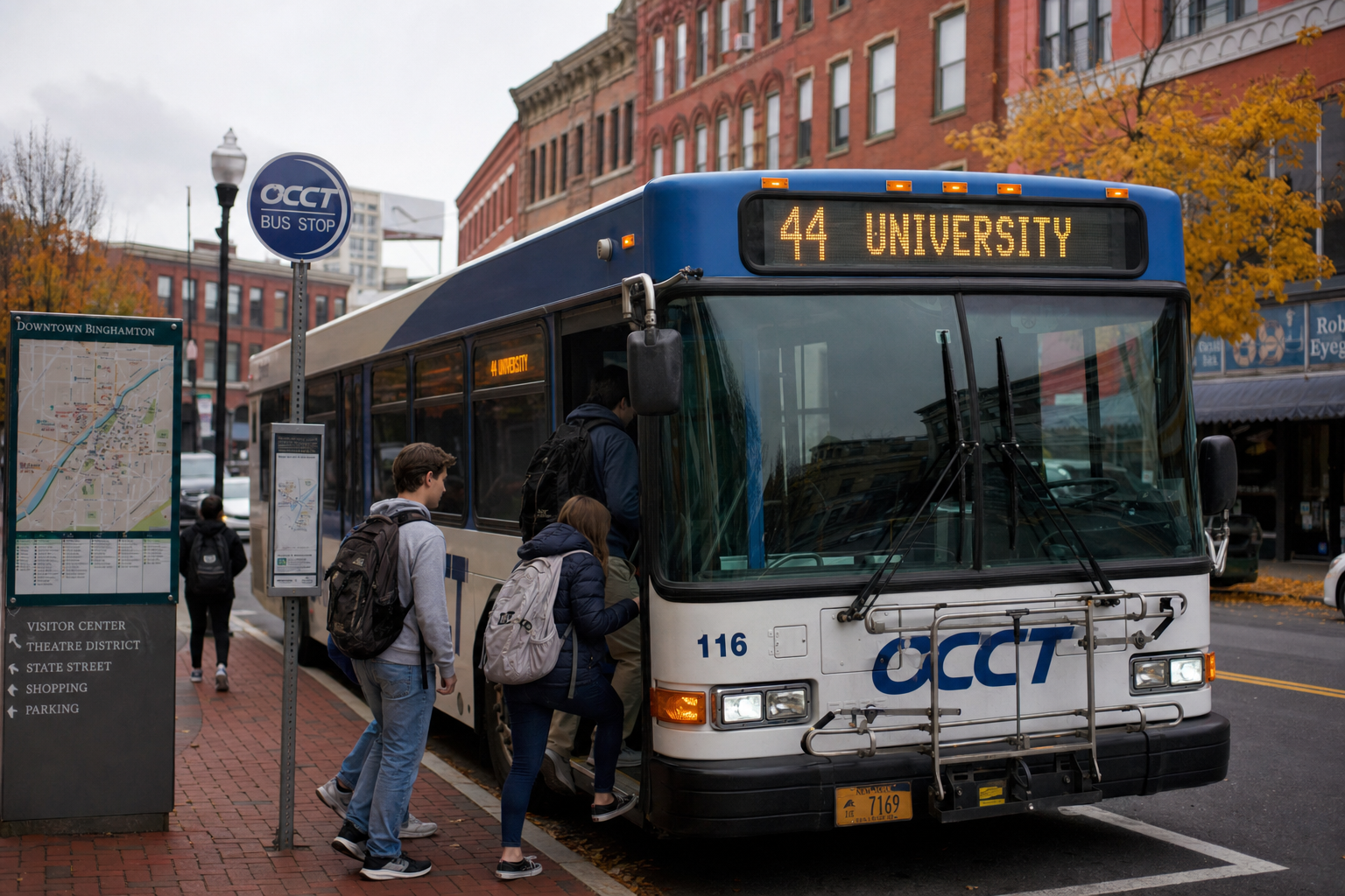 OCCT shuttle bus picking up students at a downtown Binghamton stop on a fall morning.